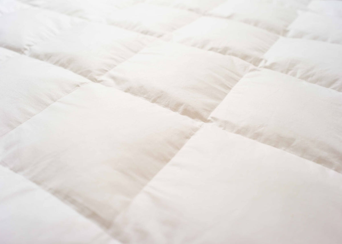 Surmatelas en plumes et duvet